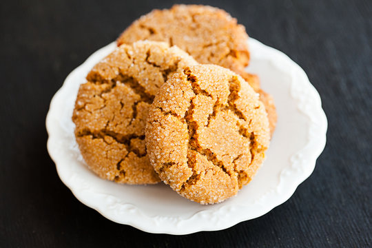 Honey ginger cookies on a black background, selective focus