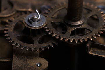 Old clockwork dirty with dust and lubricating oil. Selective foc