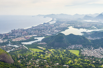 Scenic overlook of the suburban Barra da Tijuca neighborhood between the beach and lagoon from the top of the Pedra Bonita hiking trail in the Tijuca National Forest in Rio de Janeiro, Brazil