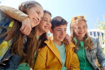 happy teenage students or friends outdoors