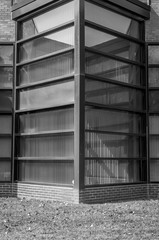 Urban Geometry. Modern architecture black and white, concrete and glass.  Abstract architectural design. Inspirational, artistic image BW. Artistic image and point of view. Reflections in window.