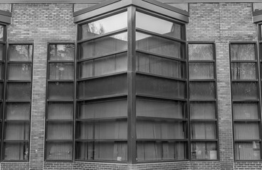 Urban Geometry. Modern architecture black and white, concrete and glass.  Abstract architectural design. Inspirational, artistic image BW. Artistic image and point of view. Reflections in window.