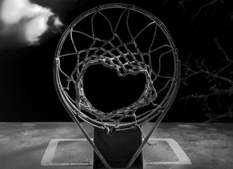 Obraz na płótnie Canvas Isolated Basketball hoop. Isolated abstract basketball hoop. Outdoor basketball court. Playground court. Black and white. Monochrome. Chromatic. 
