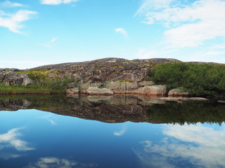 Fototapeta na wymiar reflection in the lake. The coast of the Barents Sea
