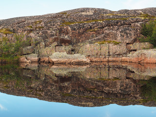 reflection in the lake. The coast of the Barents Sea