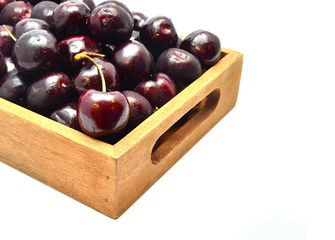 Fresh and sweet cherry in wooden box