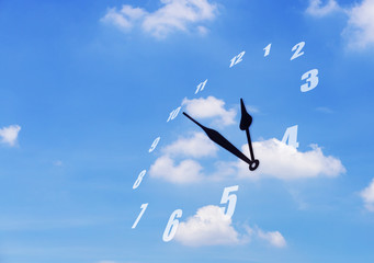 Time fly concept, clock flying on blue sky