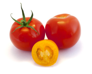 Red and yellow tomatoes on white background