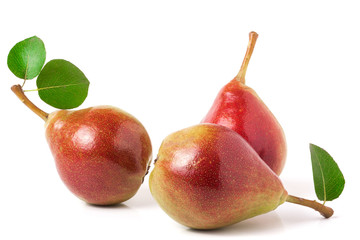 Three red pears with leaves isolated on white background