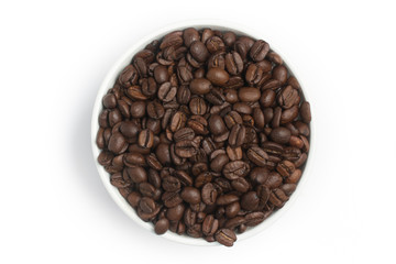 Coffee beans into a bowl. Coffea arabica