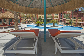 Swimming pool in luxury tropical hotel resort