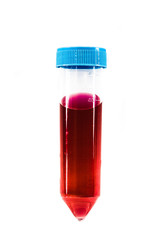 Closeup of a test tube filled with red blood on a white background.