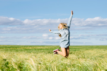 Fototapeta premium the happy girl jumps with joy
