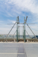 Fototapeta na wymiar design of metal movable bridge at the junction of its parts. Contact the tram wire.