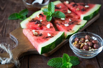 Watermelon slice popsicles with chocolate, nuts and mint