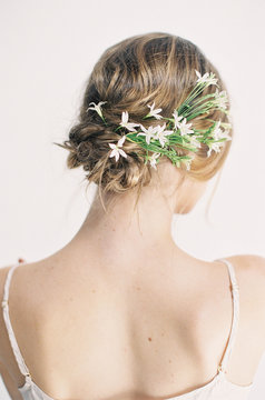 Woman wearing white flowers in hair 