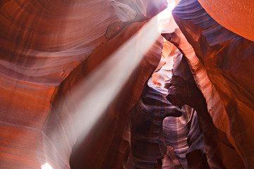 Beam of light shining in slot canyon