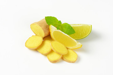 sliced ginger with lemon and lime