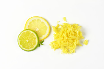 grated ginger and lemon and lime slices