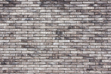Grunge gray brick wall background.