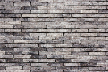 Grunge gray brick wall background.