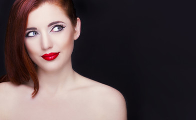 Portrait of beautiful redhead woman. Perfect makeup.