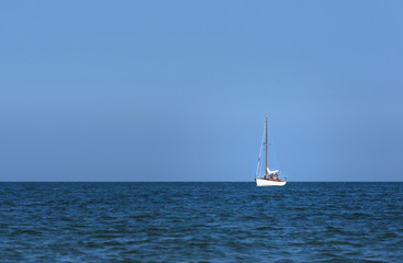 Obraz premium Lonely sailing away to the open sea