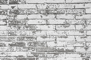 White peeling paint brick wall background.