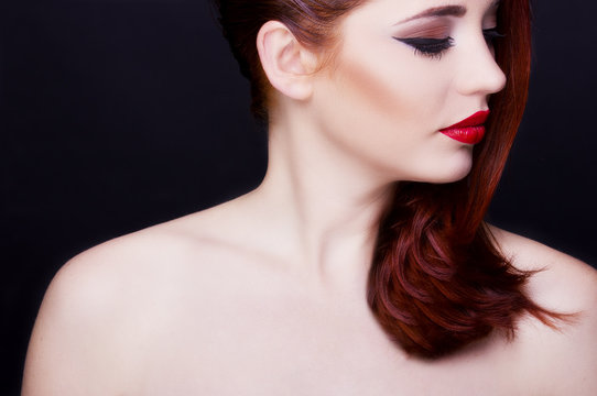 Gorgeous young woman with long eyelashes and red lips. Perfect makeup.