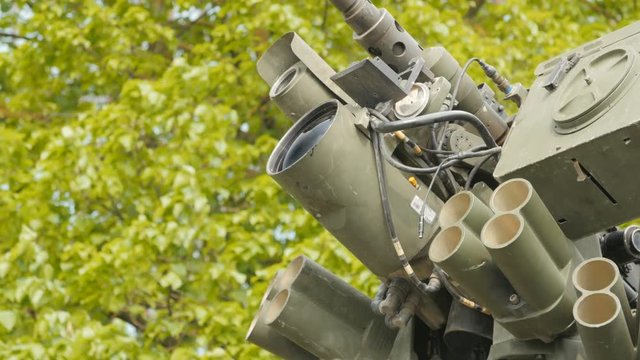 Close up view of the turret, armaments and gun of an operational military armored tank vehicle.