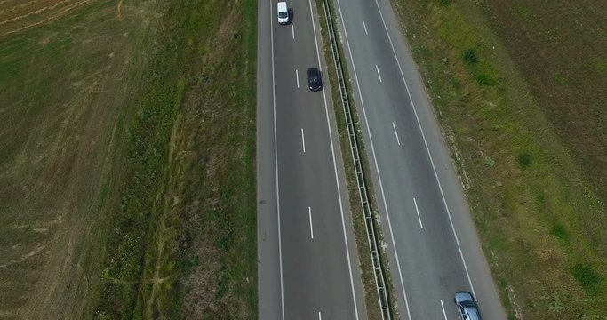 Aerial of cars traffic on a country highway in summer