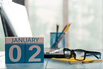 January 2nd. Day 2 of month, calendar on business office background. Winter time. Empty space for text