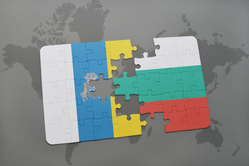 puzzle with the national flag of canary islands and bulgaria on a world map background.