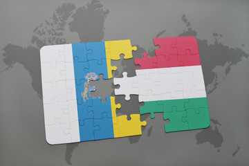 puzzle with the national flag of canary islands and hungary on a world map background.