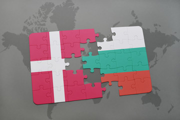 puzzle with the national flag of denmark and bulgaria on a world map background.