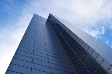 Business office building exterior against blue sky