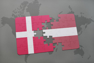 puzzle with the national flag of denmark and latvia on a world map background.