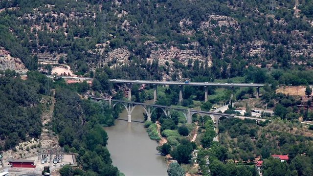 Two bridges over a river and automobile traffic on it, Spain, Catalonia