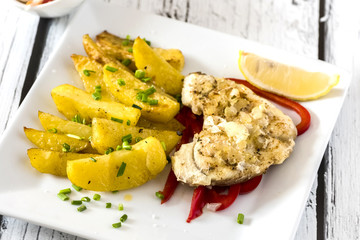 fish with baked potatoes