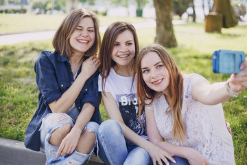Fototapeta premium three beautiful girls on walk