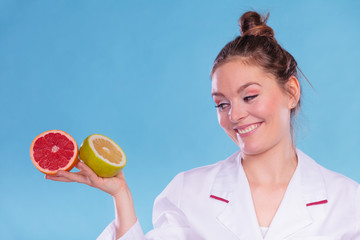 Happy dietitian nutritionist with grapefruits.