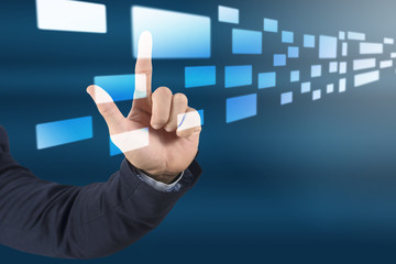 close up business man hand pushing a button on a touch screen in