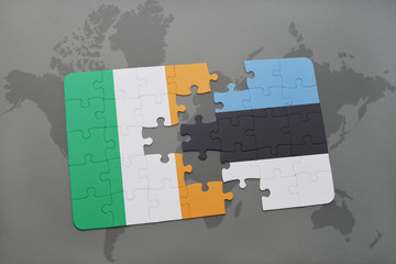 puzzle with the national flag of ireland and estonia on a world map background.