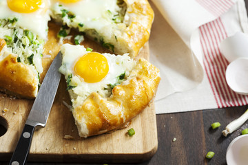 Pie with rice, green onions and egg. Galette