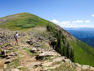Fototapeta na wymiar Female hiker on the CO trail on a mountain ridge line