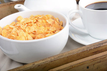Breakfast tray with coffee and cereals.