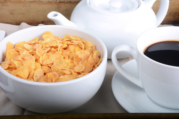 Breakfast tray with coffee and cereals.