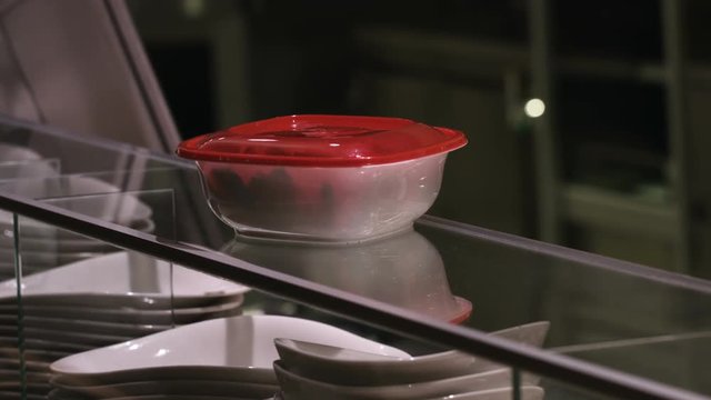 Giving and taking food container in a restaurant