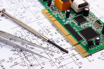 Printed circuit board and precision tools on diagram of electronics, technology