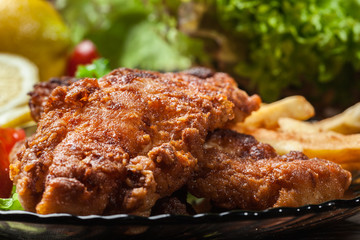 Fried fish in crispy batter with chips